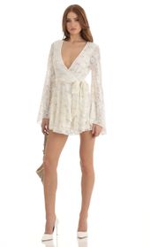 Picture thumb Raquella Sequin Lace Wrap Dress in White. Source: https://media.lucyinthesky.com/data/Dec22/170xAUTO/8e2f4842-adf3-459e-804d-b4e23f3c0b93.jpg