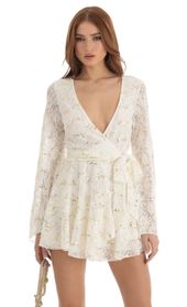 Picture thumb Raquella Sequin Lace Wrap Dress in White. Source: https://media.lucyinthesky.com/data/Dec22/170xAUTO/c4409f11-f0ae-49cf-aaa3-b0a3ffceba16.jpg