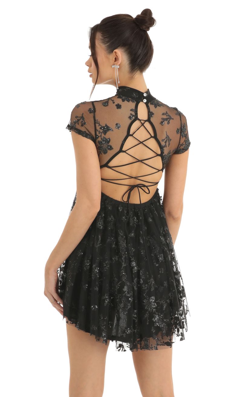 Picture Cecily Floral Sequin Baby Doll Dress in Black. Source: https://media.lucyinthesky.com/data/Dec22/800xAUTO/19aa859e-b80e-4aa0-886b-4489c5abc8d8.jpg