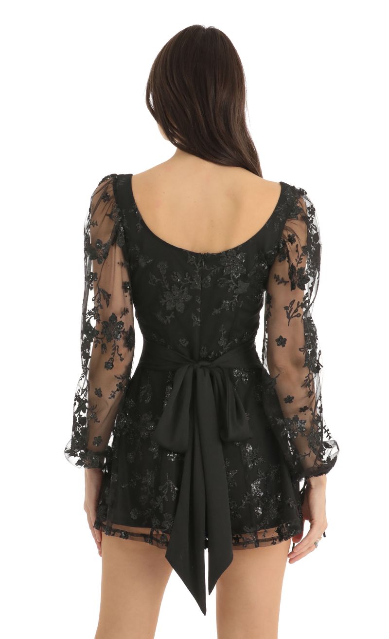 Picture Betty Floral Glitter A-Line Dress in Black. Source: https://media.lucyinthesky.com/data/Dec22/800xAUTO/2e286254-626c-4514-8156-de1c2202cb04.jpg