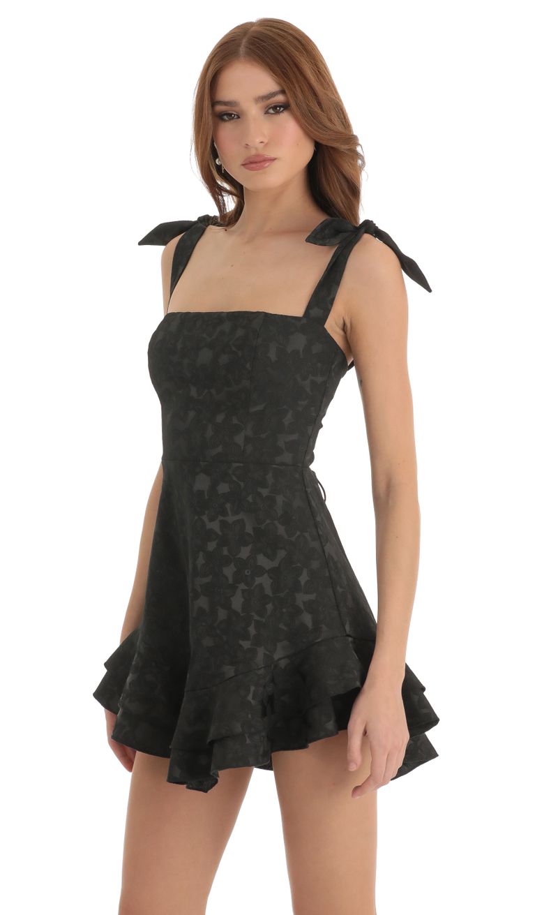 Picture Tallie Floral Jacquard Ruffle Dress in Black. Source: https://media.lucyinthesky.com/data/Dec22/800xAUTO/523952db-6cd7-4151-bbaa-dabccd1f00e2.jpg