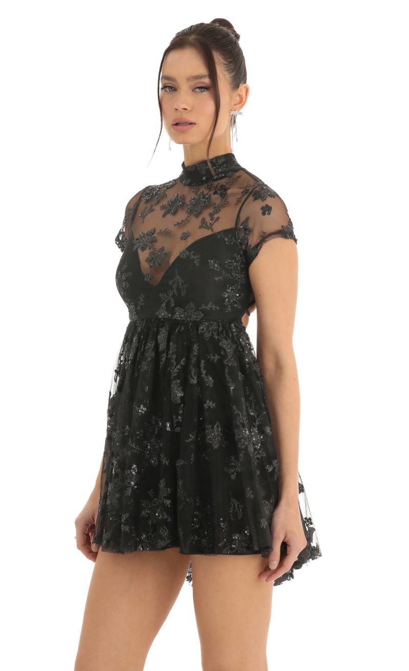Picture Cecily Floral Sequin Baby Doll Dress in Black. Source: https://media.lucyinthesky.com/data/Dec22/800xAUTO/6f398c56-591b-4db0-988d-6ab4de0dd93d.jpg
