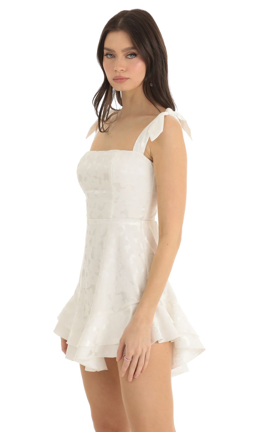 Picture Tallie Floral Jacquard Ruffle Dress in White. Source: https://media.lucyinthesky.com/data/Dec22/850xAUTO/1be9a1a3-458c-48be-99e2-a76b0855d02b.jpg