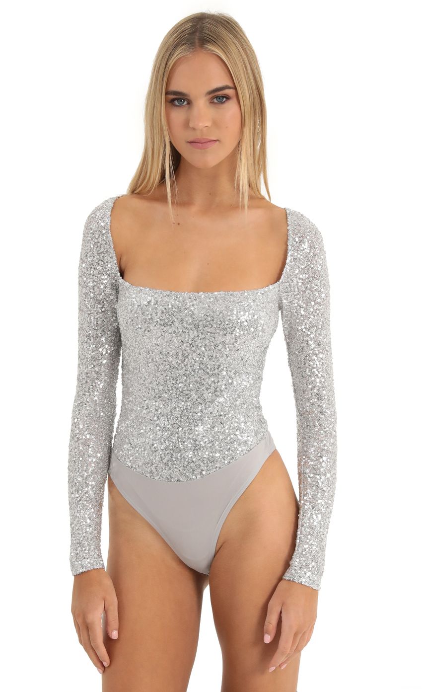 Picture Aislin Sequin Long Sleeve Bodysuit in Silver. Source: https://media.lucyinthesky.com/data/Dec22/850xAUTO/2235d5b6-b59a-4fa2-ab11-499b110f53f3.jpg