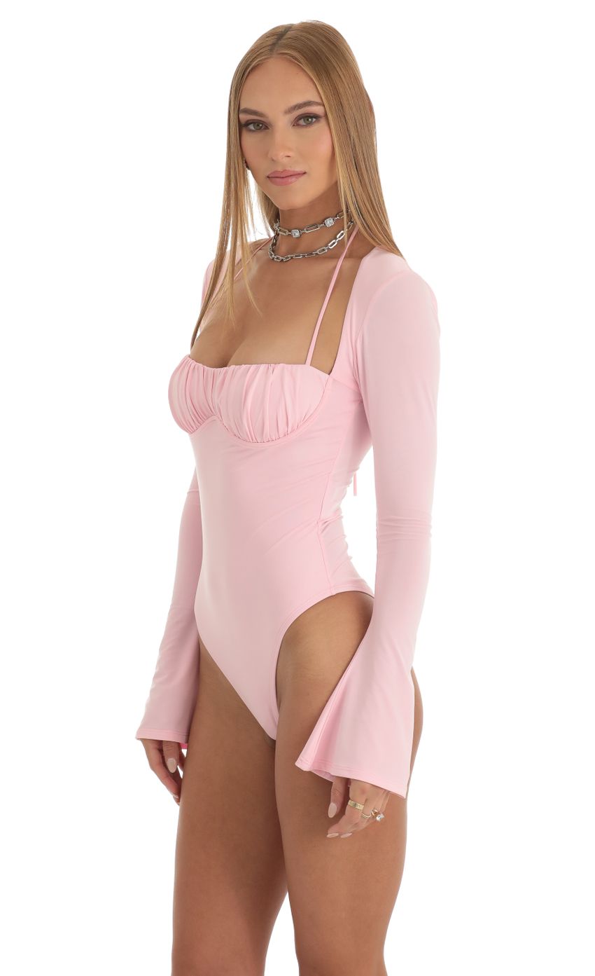 Picture Lexa Flare Long Sleeve Bodysuit in Pink. Source: https://media.lucyinthesky.com/data/Dec22/850xAUTO/24a1ac2f-f69b-47ff-a2c8-27b421b508d7.jpg