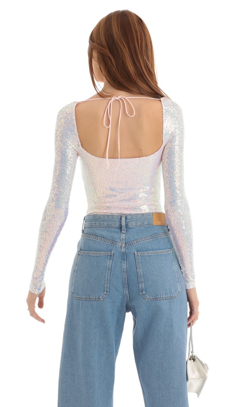 Picture Aislin Iridescent Sequin Long Sleeve Bodysuit in White. Source: https://media.lucyinthesky.com/data/Dec22/850xAUTO/271af183-6aab-44fa-837c-74ce5a0751fb.jpg