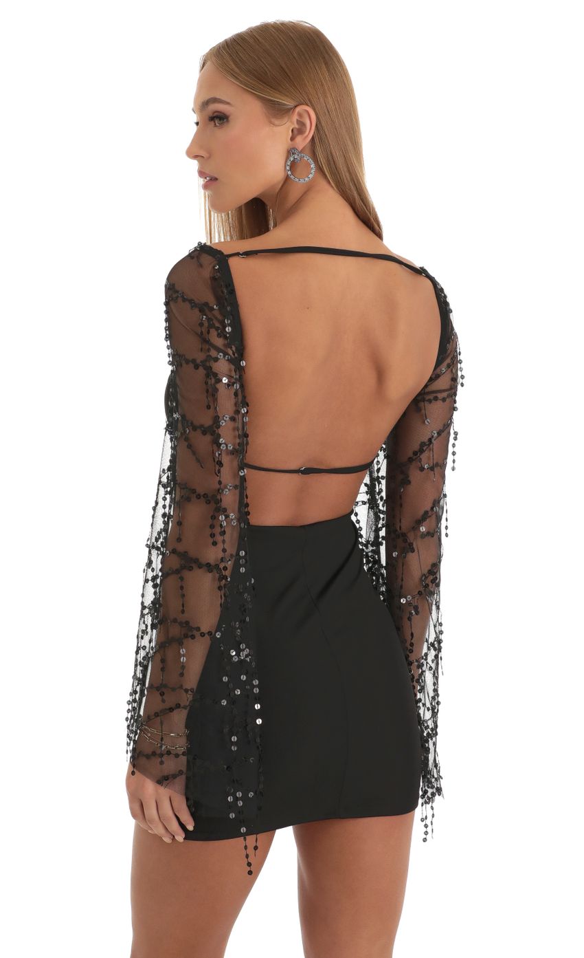 Picture Korra Sequin Flare Sleeve Dress in Black. Source: https://media.lucyinthesky.com/data/Dec22/850xAUTO/2ca39479-0350-4171-b45e-57ae12b3bc2f.jpg