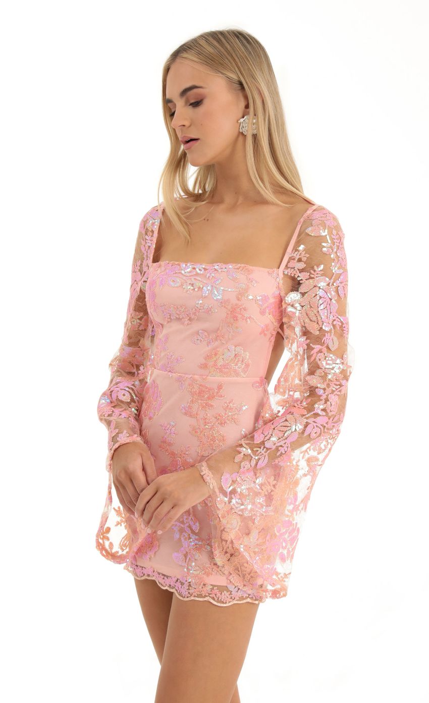 Picture Vida Lace Sequin Flare Sleve Dress in Peach. Source: https://media.lucyinthesky.com/data/Dec22/850xAUTO/2de8010a-23e4-4342-8900-b24946ee0d61.jpg