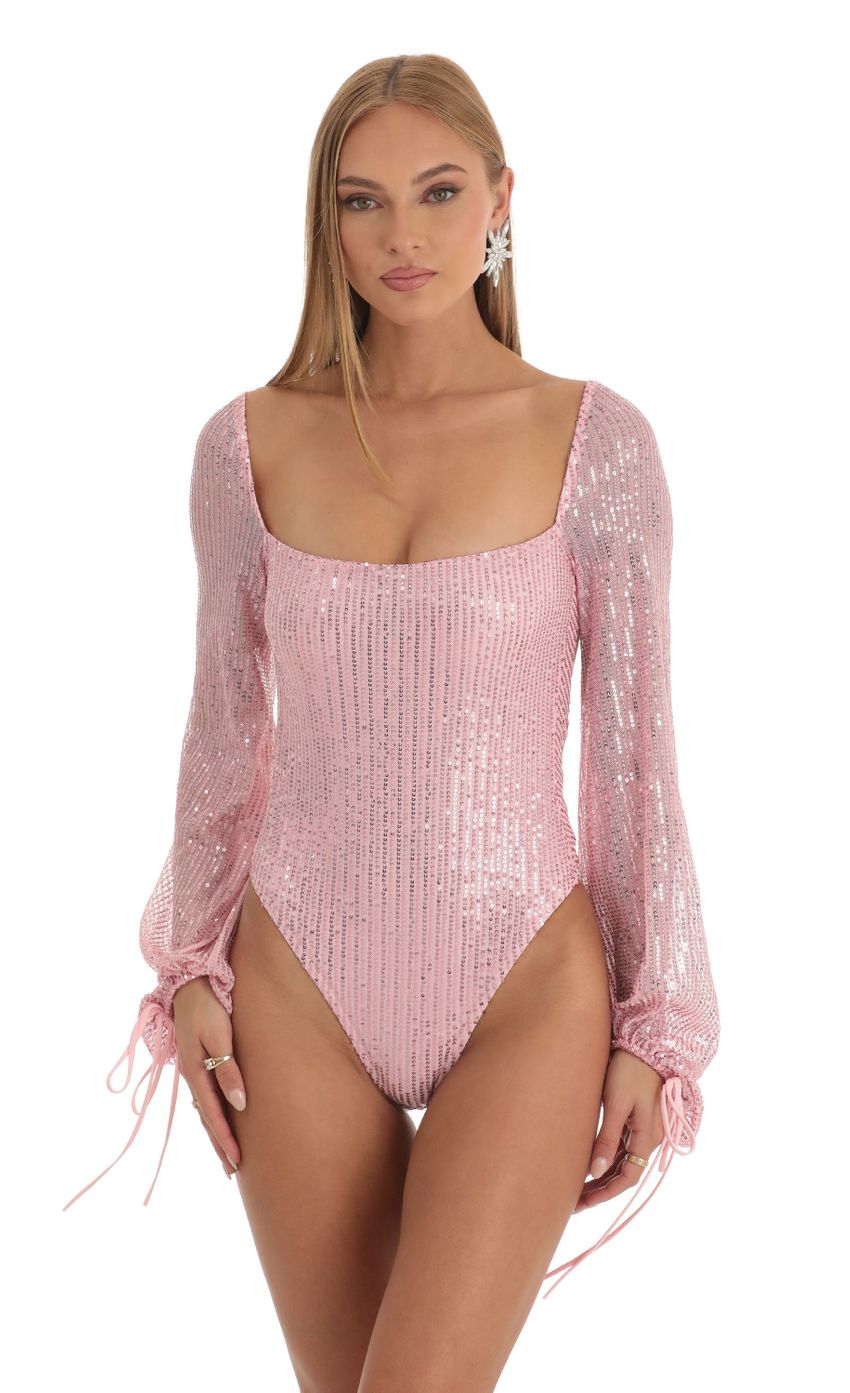 Picture Amory Sequin Long Sleeve Bodysuit in Pink. Source: https://media.lucyinthesky.com/data/Dec22/850xAUTO/34cfaf03-8a51-47cb-a3a1-b1438a12c949.jpg