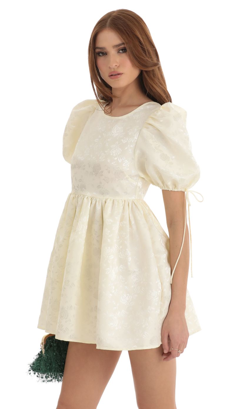 Picture Laila Floral Jacquard Baby Doll Dress in Cream. Source: https://media.lucyinthesky.com/data/Dec22/850xAUTO/3689cb70-3c93-45c4-b618-be6fe786a9e0.jpg