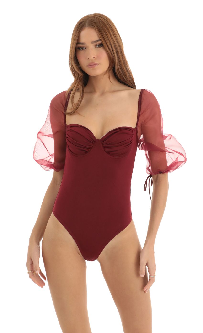 Picture Adrianna Puff Sleeve Bodysuit in Red. Source: https://media.lucyinthesky.com/data/Dec22/850xAUTO/49239004-e33e-4881-be6e-10f063ad96fc.jpg