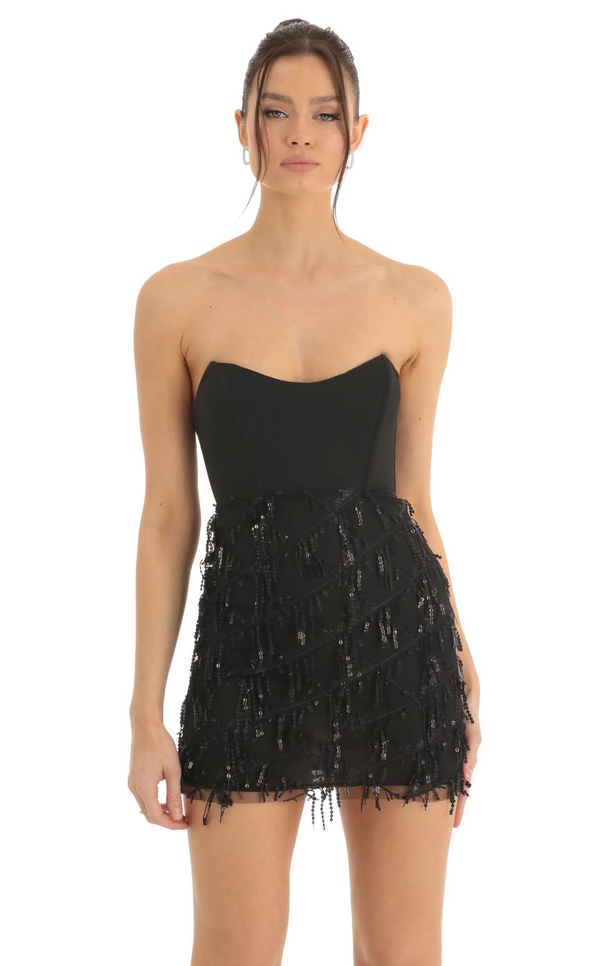 Picture Hollie Dangling Sequin Corset Dress in Black. Source: https://media.lucyinthesky.com/data/Dec22/850xAUTO/665db9d4-9e1c-4afb-80bf-43b7805be792.jpg