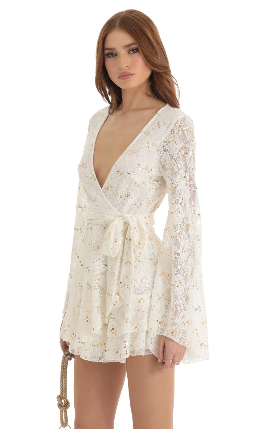 Picture Raquella Sequin Lace Wrap Dress in White. Source: https://media.lucyinthesky.com/data/Dec22/850xAUTO/718d0ecc-6ceb-4577-bfd5-915f398f4e1d.jpg