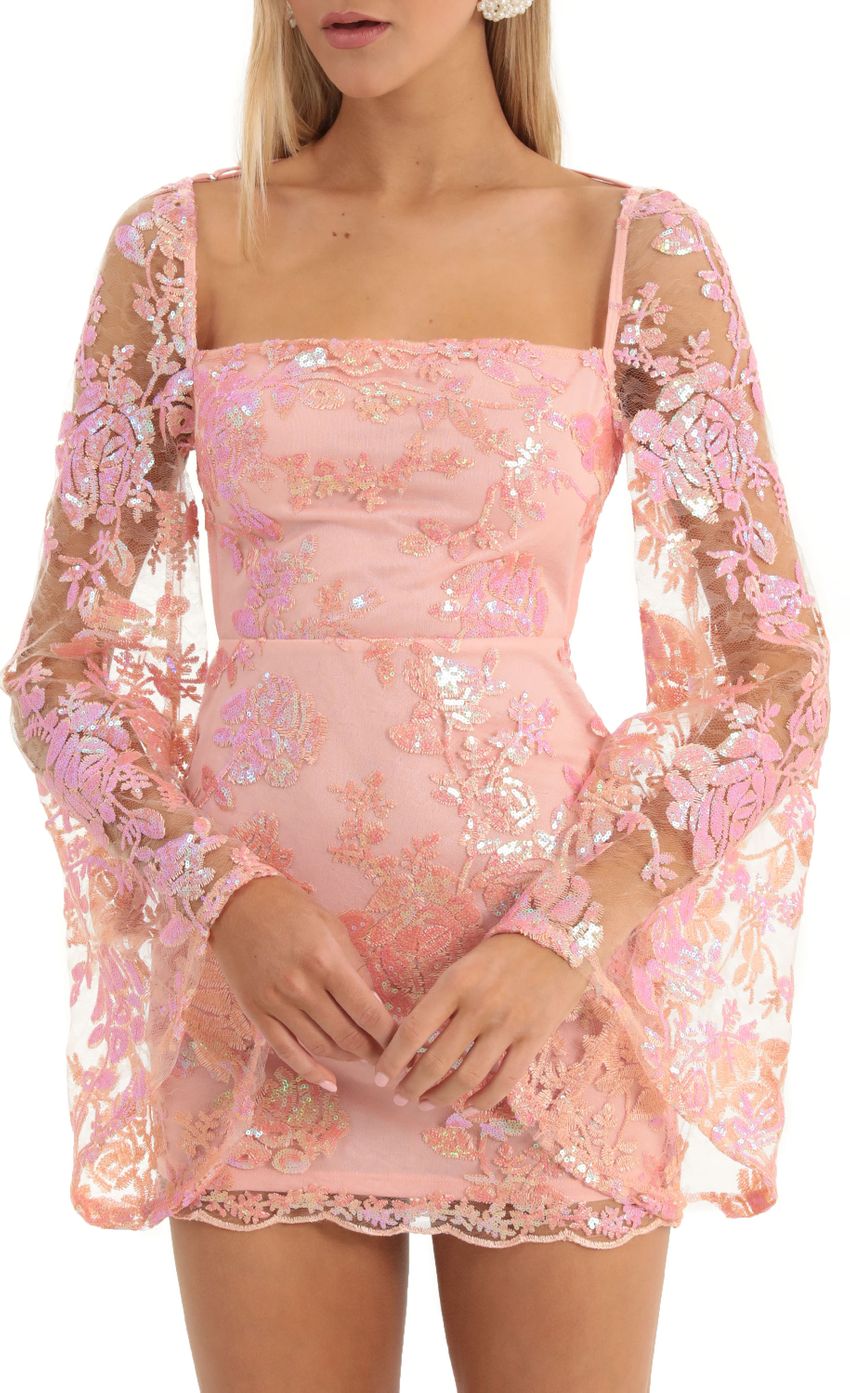 Picture Vida Lace Sequin Flare Sleve Dress in Peach. Source: https://media.lucyinthesky.com/data/Dec22/850xAUTO/79a2388a-60fd-4838-ab0e-f0caccdc4c6f.jpg