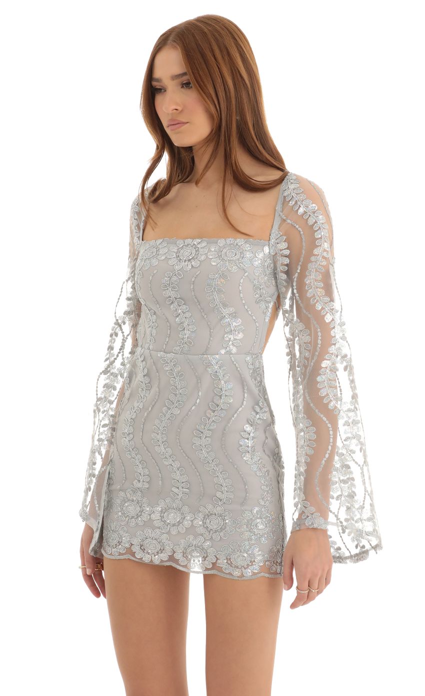 Picture Vida Sequin Flare Sleve Dress in Silver. Source: https://media.lucyinthesky.com/data/Dec22/850xAUTO/7fb38556-23d2-452c-a8d0-4a2d044d7709.jpg