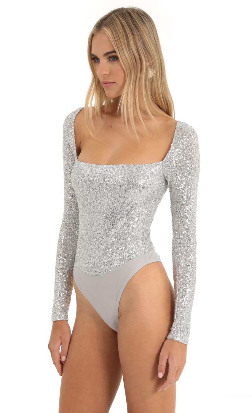 Picture Aislin Sequin Long Sleeve Bodysuit in Silver. Source: https://media.lucyinthesky.com/data/Dec22/850xAUTO/84aa5a0c-ca22-4326-a9c1-2000c2325551.jpg