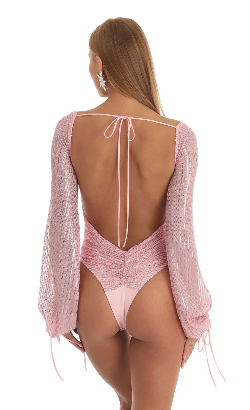 Picture Amory Sequin Long Sleeve Bodysuit in Pink. Source: https://media.lucyinthesky.com/data/Dec22/850xAUTO/86aa0f0e-59f2-404d-9059-db79a5d05805.jpg