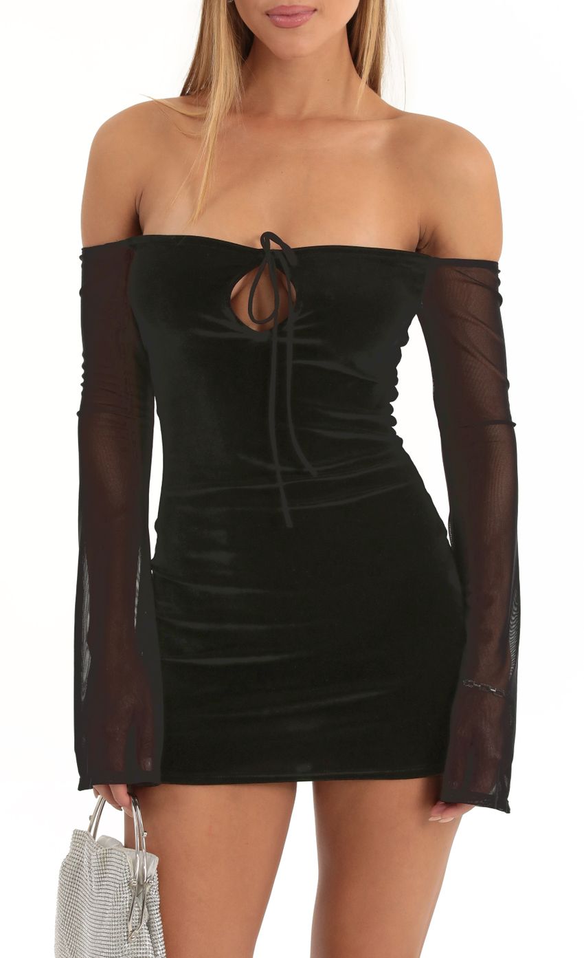 Picture Gianni Velvet Off The Shoulder Dress in Black. Source: https://media.lucyinthesky.com/data/Dec22/850xAUTO/8739449c-ceb9-4f4c-b87d-65d93092b1b4.jpg
