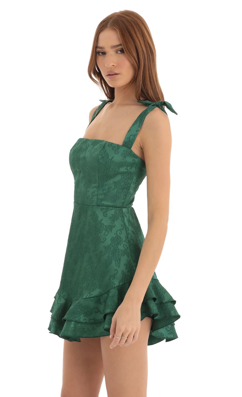 Picture Tallie Floral Jacquard Ruffle Dress in Green. Source: https://media.lucyinthesky.com/data/Dec22/850xAUTO/8957a36d-81c5-4fea-8b5f-592482f259f3.jpg