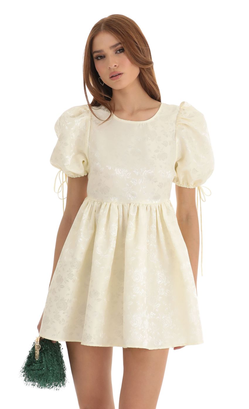 Picture Laila Floral Jacquard Baby Doll Dress in Cream. Source: https://media.lucyinthesky.com/data/Dec22/850xAUTO/9c3fd1ce-218e-48c4-8d80-10f71215d28f.jpg