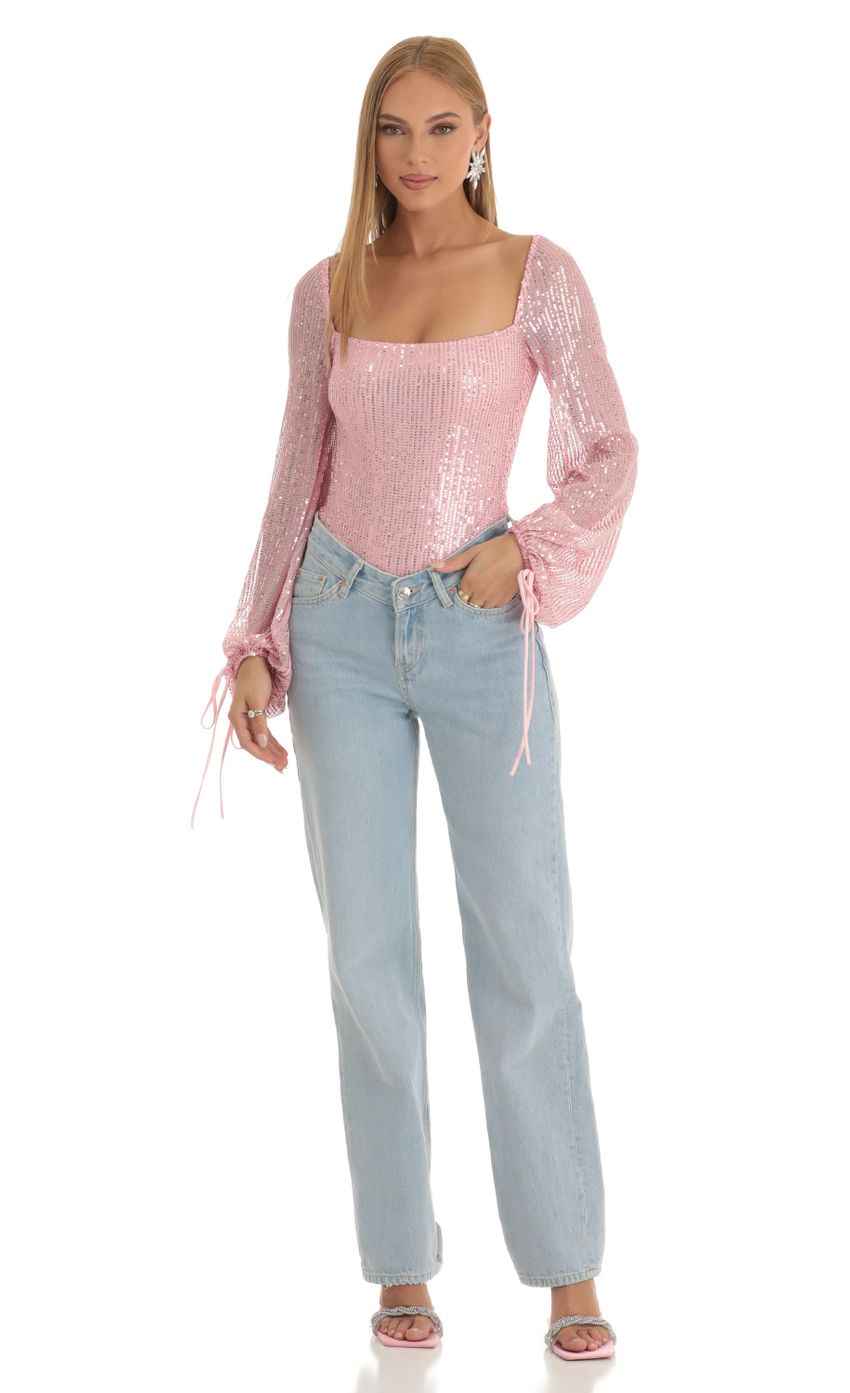 Picture Amory Sequin Long Sleeve Bodysuit in Pink. Source: https://media.lucyinthesky.com/data/Dec22/850xAUTO/b3cc351a-f33d-4058-9cbe-2a49d9feacbc.jpg