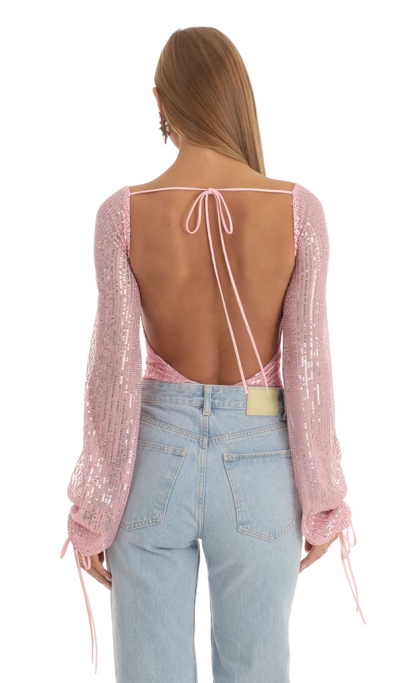 Picture Amory Sequin Long Sleeve Bodysuit in Pink. Source: https://media.lucyinthesky.com/data/Dec22/850xAUTO/cd418189-43dd-48f1-a251-be4a34a6480e.jpg