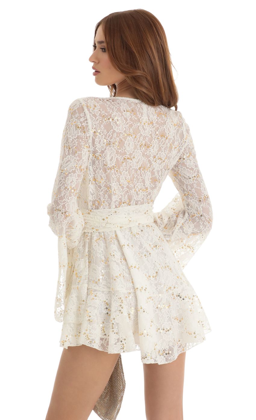 Picture Raquella Sequin Lace Wrap Dress in White. Source: https://media.lucyinthesky.com/data/Dec22/850xAUTO/dae8c9a6-3deb-4af3-9964-747c719356d0.jpg