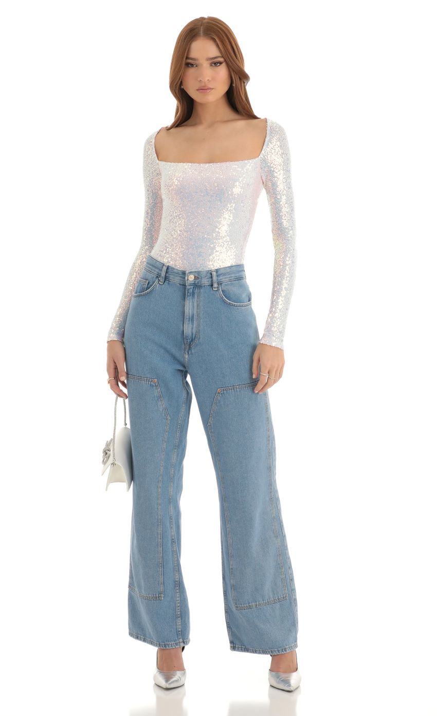 Picture Aislin Iridescent Sequin Long Sleeve Bodysuit in White. Source: https://media.lucyinthesky.com/data/Dec22/850xAUTO/ddf1657a-27bc-4e23-af1b-c58f316baf24.jpg