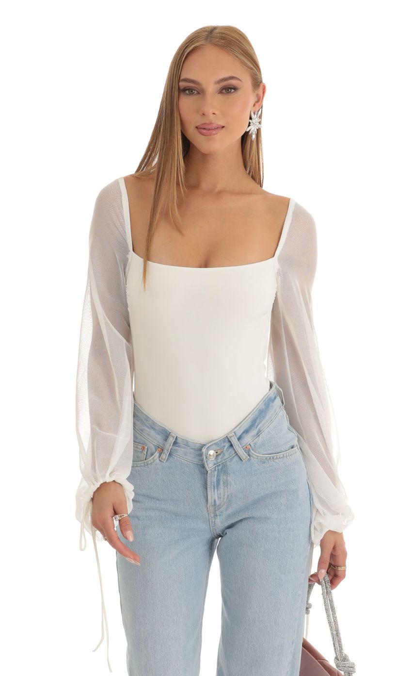 Picture Amory Mesh Long Sleeve Bodysuit in White. Source: https://media.lucyinthesky.com/data/Dec22/850xAUTO/efba8f34-f4f9-45b4-9fa0-597aaefcc5a3.jpg