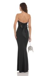 Picture Back Bow Strapless Maxi Dress in Black. Source: https://media.lucyinthesky.com/data/Dec23/150xAUTO/520cc516-b83f-4f81-810c-a9cec811d3ab.jpg