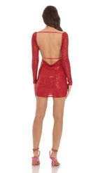 Picture Emory Sequin Long Sleeve Bodycon Dress in Red. Source: https://media.lucyinthesky.com/data/Dec23/150xAUTO/548aaa4f-c2fc-48f0-8ced-e8dbb05cf859.jpg