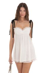 Picture Mesh Velvet Shoulder Ties Babydoll Dress in White. Source: https://media.lucyinthesky.com/data/Dec23/150xAUTO/b264d349-b8cd-4446-b403-2ef61dd2d5fe.jpg