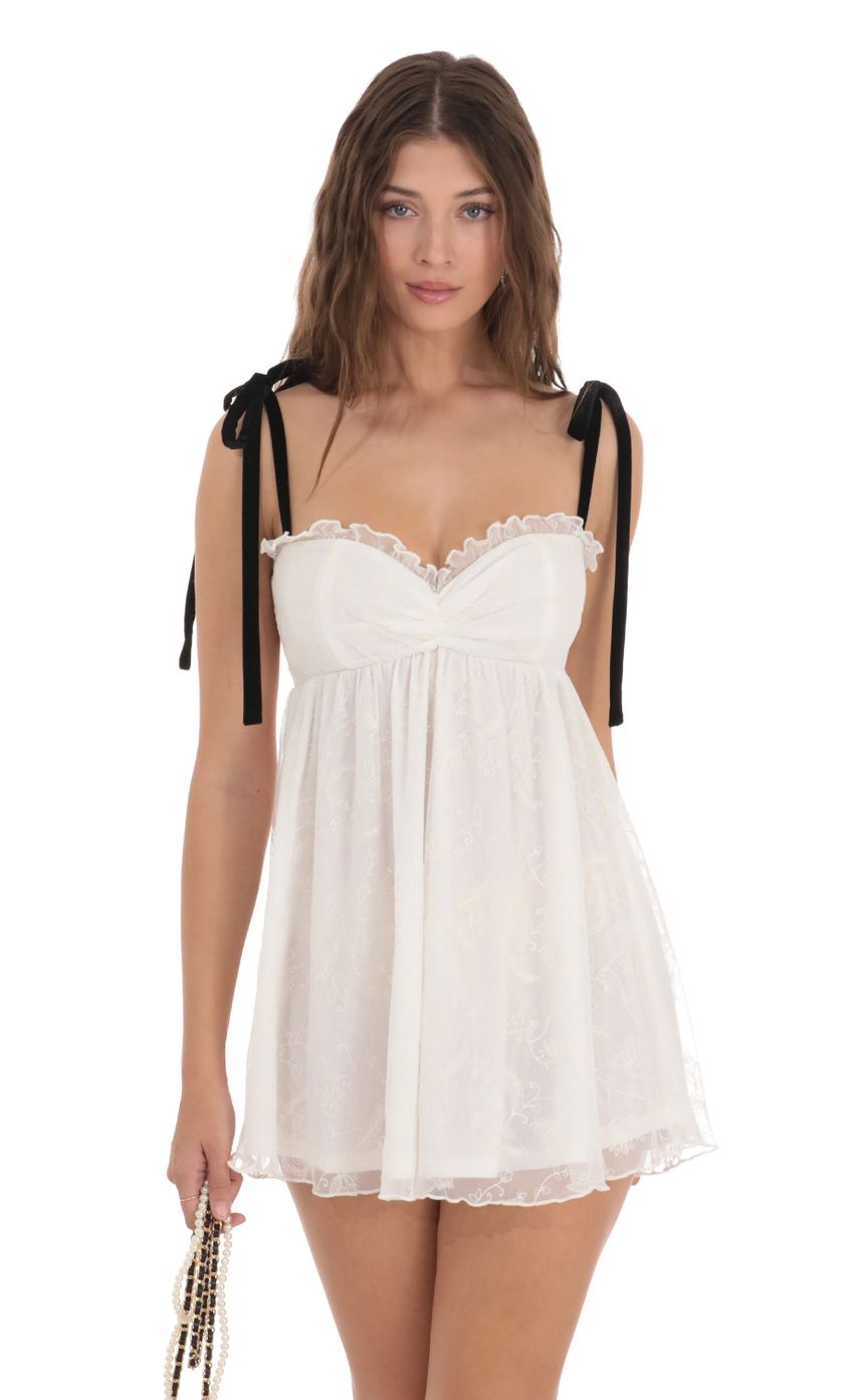Picture Mesh Velvet Shoulder Ties Babydoll Dress in White. Source: https://media.lucyinthesky.com/data/Dec23/850xAUTO/b264d349-b8cd-4446-b403-2ef61dd2d5fe.jpg