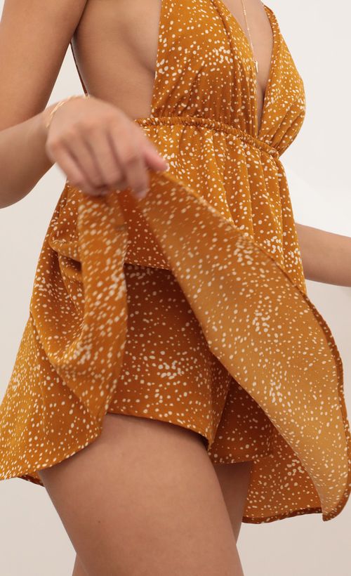 Picture Skye Shoulder Tie Romper in Mustard. Source: https://media.lucyinthesky.com/data/Feb21_1/500xAUTO/AT2A5423.JPG