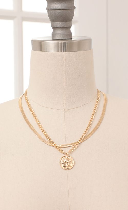Picture Cherub Layered Necklace in Gold. Source: https://media.lucyinthesky.com/data/Feb21_1/500xAUTO/AT2A92631.JPG