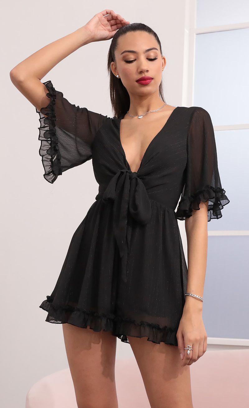 Picture Baylee Ruffle Romper in Black. Source: https://media.lucyinthesky.com/data/Feb21_1/800xAUTO/1V9A2500.JPG