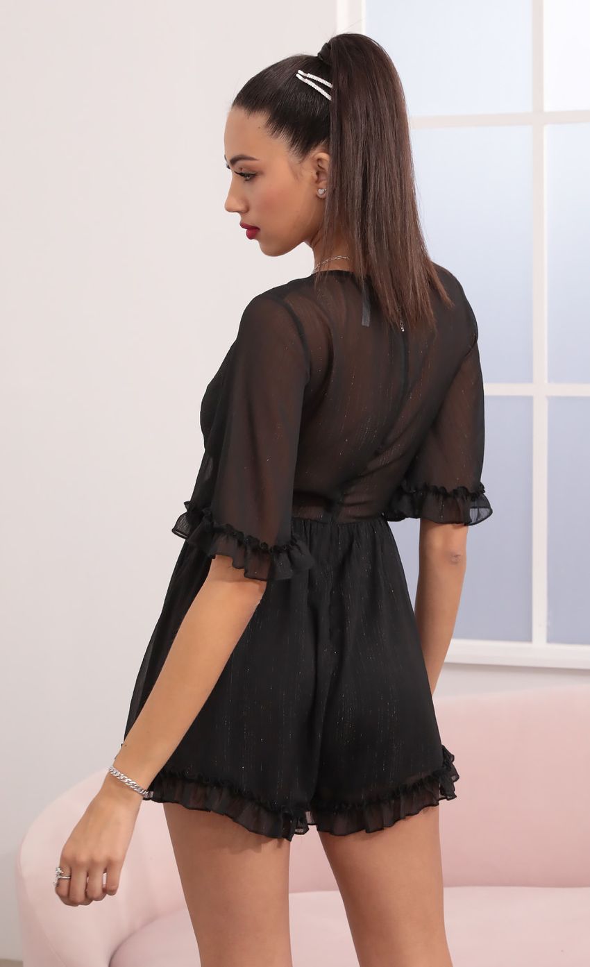 Picture Baylee Ruffle Romper in Black. Source: https://media.lucyinthesky.com/data/Feb21_1/850xAUTO/1V9A2572.JPG