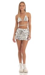 Picture Maddie Floral Sequin Two Piece Skirt Set in White. Source: https://media.lucyinthesky.com/data/Feb23/150xAUTO/64606457-820e-4555-b35d-40012c905bec.jpg