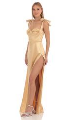 Picture Aries Satin Slit Maxi Dress in Gold. Source: https://media.lucyinthesky.com/data/Feb23/150xAUTO/b6d5418d-7614-4467-a29b-a2b67779f8cf.jpg
