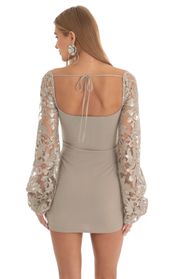 Picture thumb Laurice Sequin Floral Long Sleeve Dress in Tan. Source: https://media.lucyinthesky.com/data/Feb23/170xAUTO/aa49da56-41da-443e-afa0-a99c870a0be9.jpg
