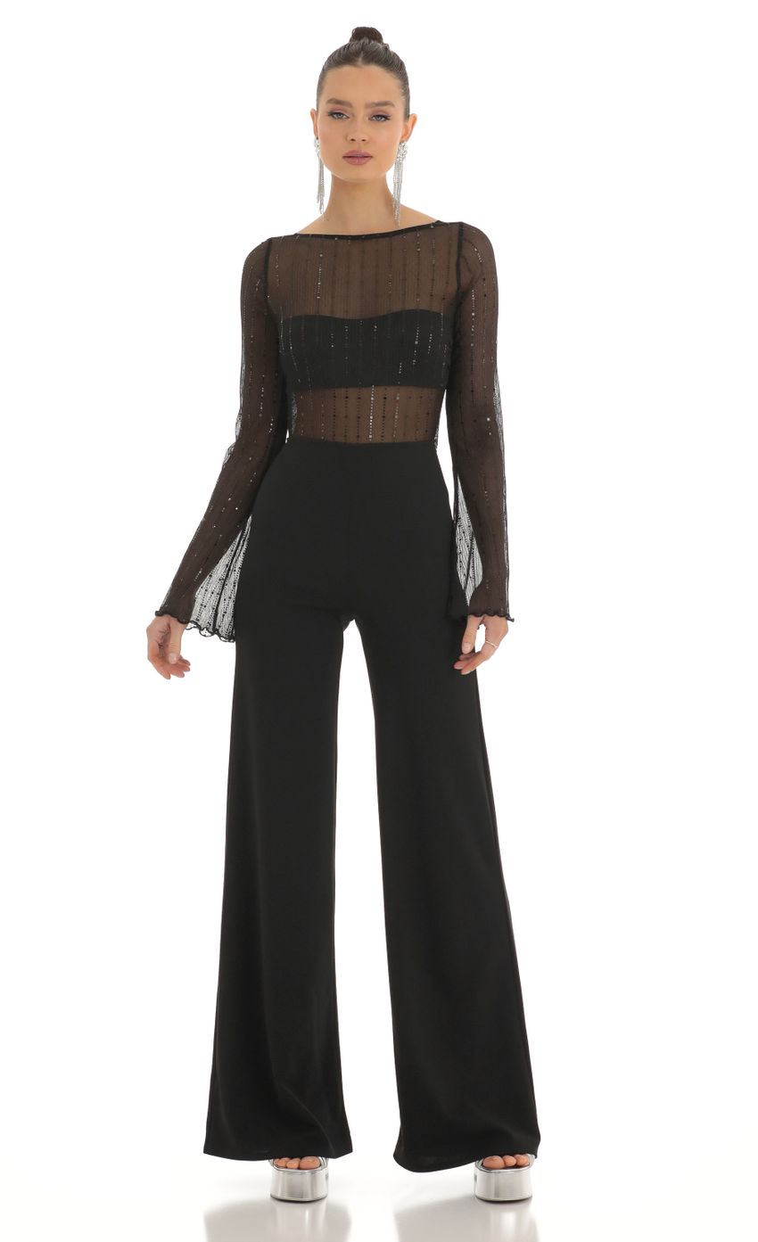 Picture Olean Sequin Striped Long Sleeve Jumpsuit in Black. Source: https://media.lucyinthesky.com/data/Feb23/850xAUTO/03da9c97-cc4a-425d-b7f3-6329ed63e2fc.jpg