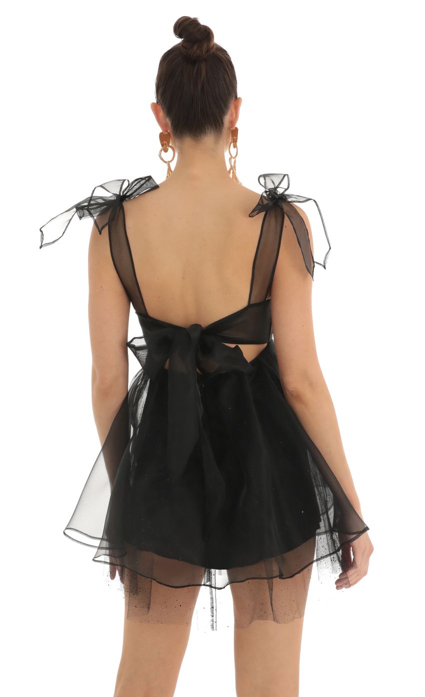 Picture Saren Glitter Bow Baby Doll Dress in Black. Source: https://media.lucyinthesky.com/data/Feb23/850xAUTO/0bf6cb9d-961e-4396-9ee4-f3a4b381eefb.jpg