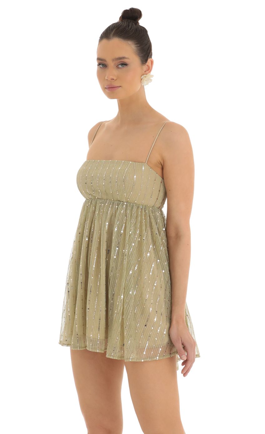 Picture Liora Metallic Mesh Baby Doll Dress in Gold. Source: https://media.lucyinthesky.com/data/Feb23/850xAUTO/174f1af3-3f42-4495-8ecd-9db1feec862a.jpg