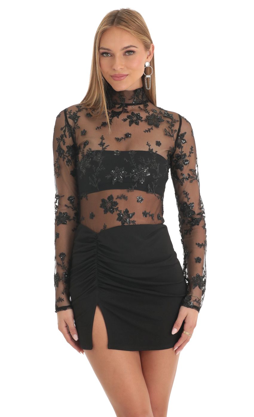 Picture Helia Tulle Glitter Sheer Mock Neck Dress in Black. Source: https://media.lucyinthesky.com/data/Feb23/850xAUTO/79e00fe7-0db9-44e0-a7f6-6ebb22266fb5.jpg
