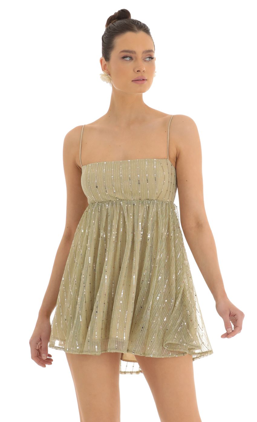 Picture Liora Metallic Mesh Baby Doll Dress in Gold. Source: https://media.lucyinthesky.com/data/Feb23/850xAUTO/9ca8b381-5cbb-4367-8ed0-45d461a37b28.jpg