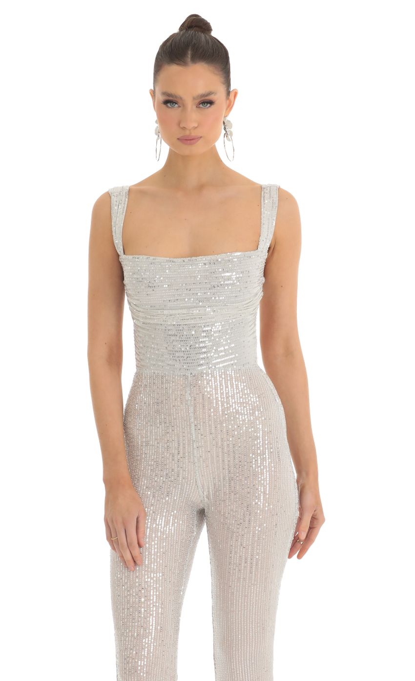 Picture Lupita Sequin Wide Leg Slit Jumpsuit in Silver. Source: https://media.lucyinthesky.com/data/Feb23/850xAUTO/b5bd5aab-d0cd-48eb-9f37-5c7958403500.jpg