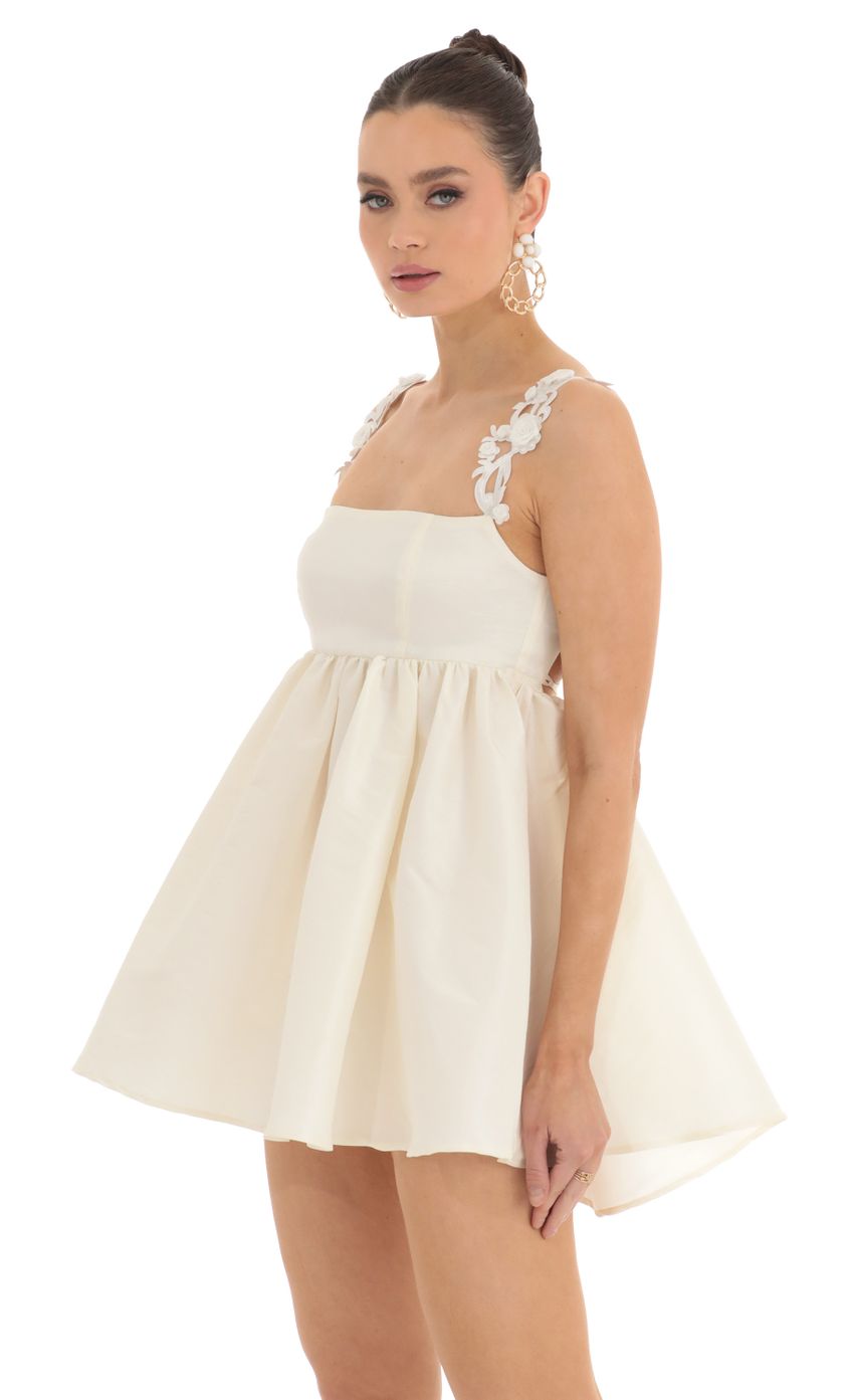 Picture Coco Floral Strap Baby Doll Dress in Cream. Source: https://media.lucyinthesky.com/data/Feb23/850xAUTO/dc729c1e-27a2-400c-891f-3029f6b43901.jpg