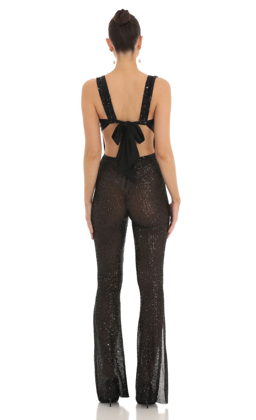 Picture Lupita Sequin Back Bow Tie Slit Jumpsuit in Black. Source: https://media.lucyinthesky.com/data/Feb23/850xAUTO/eee666dd-2271-4cda-9b3a-623fdd3b6ae2.jpg
