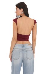 Picture High Neck Open Back Top in Black. Source: https://media.lucyinthesky.com/data/Feb24/150xAUTO/898cd572-d733-41b9-819c-e926b523318f.jpg