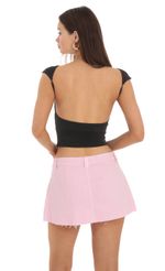 Picture High Neck Open Back Top in Black. Source: https://media.lucyinthesky.com/data/Feb24/150xAUTO/b4311850-f259-4b41-8930-fa531d88416f.jpg